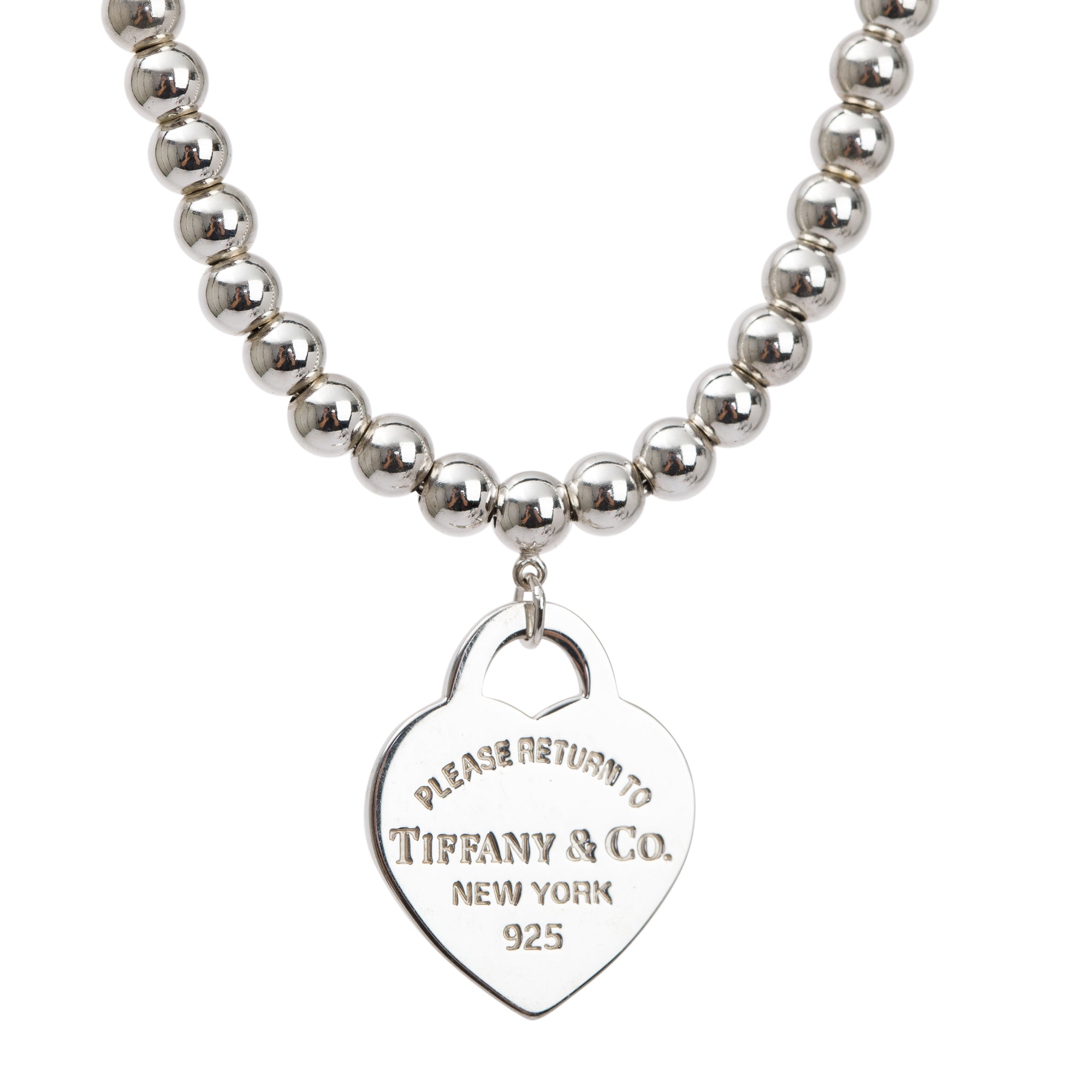Return to Tiffany® small heart tag in sterling silver on a bead necklace.